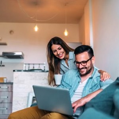Couple reviewing information on a laptop